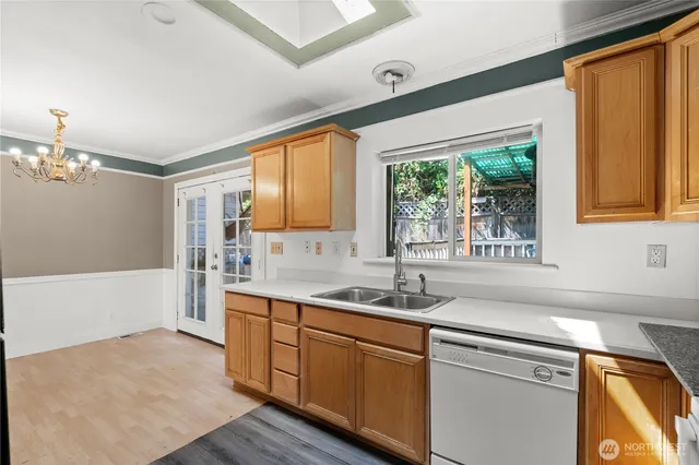 a kitchen with a sink stove and microwave