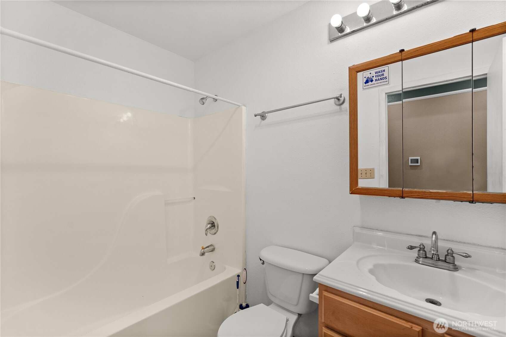 5039 31st Avenue South Seattle, WA 98108 - Photo 17 of 25 a bathroom with a bathtub shower sink vanity and toilet