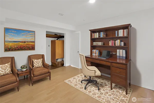 a view of a livingroom with workspace and a couch