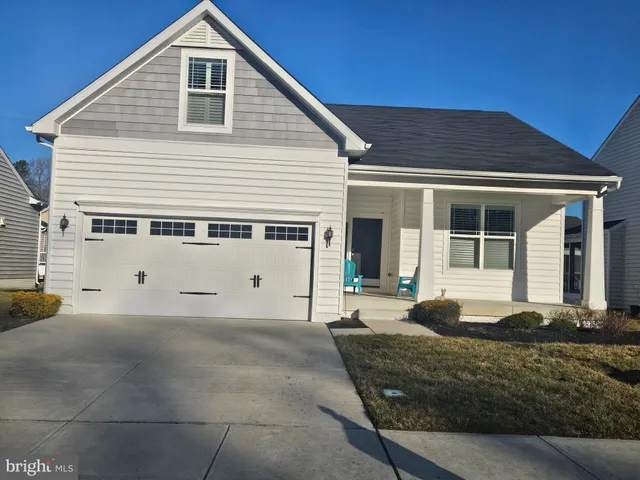 a front view of a house with a garage