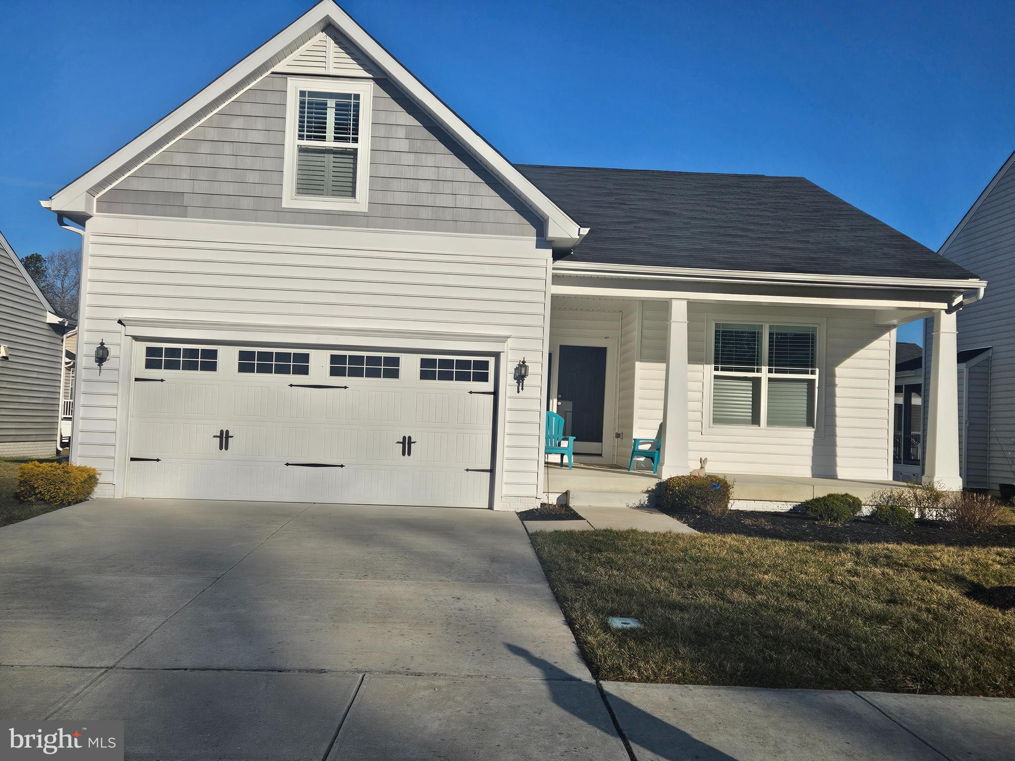 a front view of a house with a garage