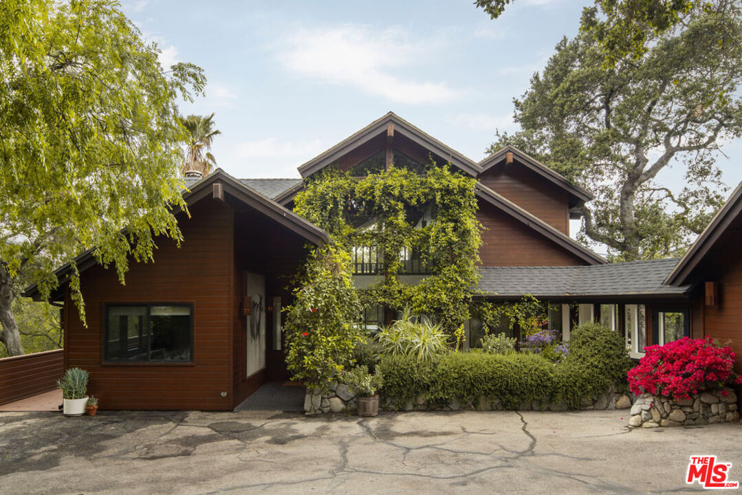 360 Edwards Place Glendale, CA 91206 - Photo 1 of 2 a front view of a house with garden