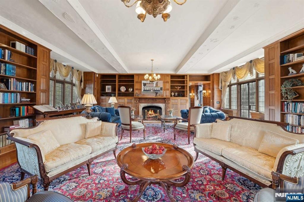 131 Rensselaer Road Essex Fells, NJ 07021 - Photo 17 of 48 a living room with fireplace furniture and a rug
