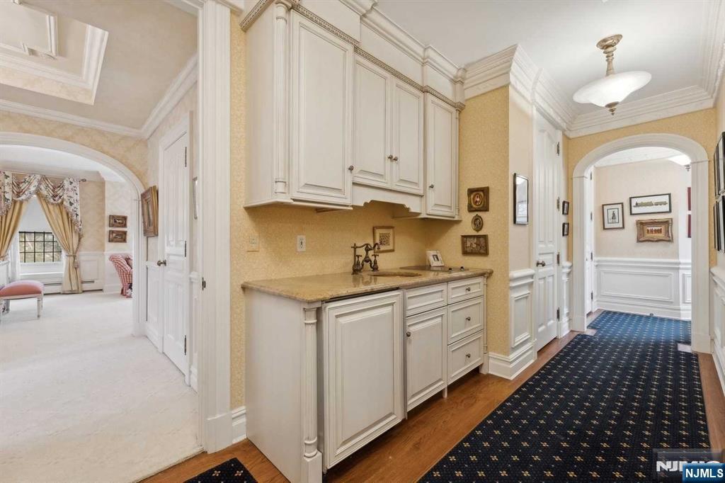 131 Rensselaer Road Essex Fells, NJ 07021 - Photo 33 of 48 a kitchen with granite countertop white cabinets and white appliances