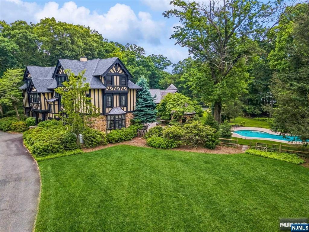 131 Rensselaer Road Essex Fells, NJ 07021 - Photo 5 of 48 a view of a house with a big yard plants and large trees