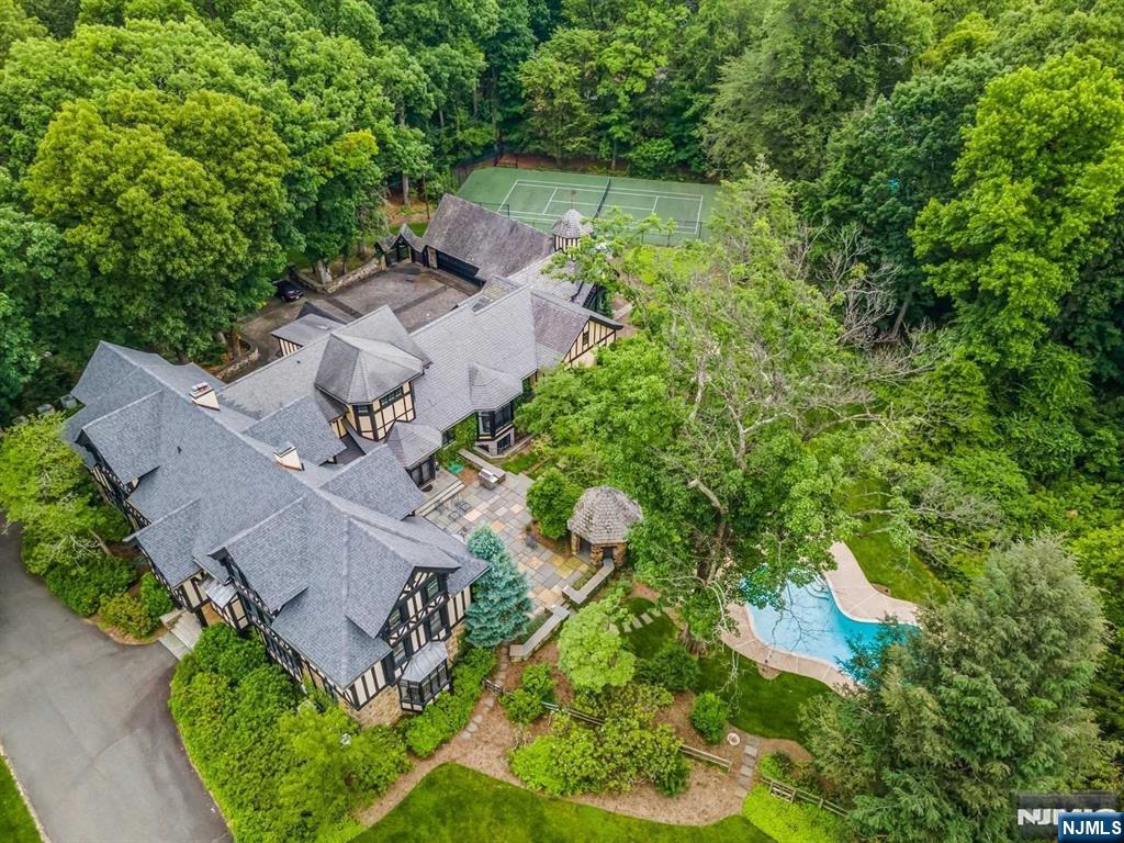131 Rensselaer Road Essex Fells, NJ 07021 - Photo 6 of 48 an aerial view of a house with a yard