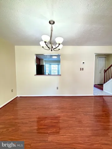 a view of a room with a wooden floor