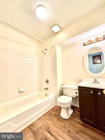 a bathroom with a sink toilet and a bathtub