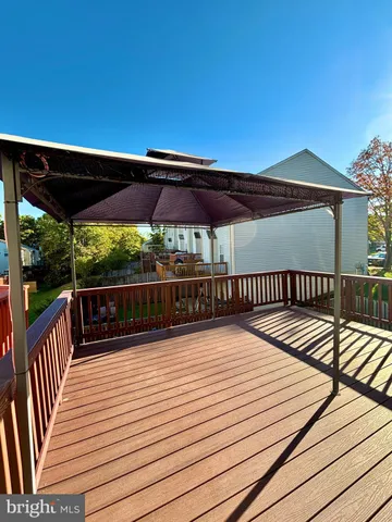 a view of wooden deck with a patio
