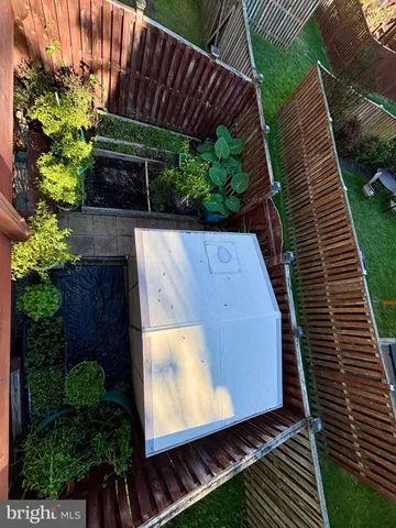 a view of a backyard with sitting area