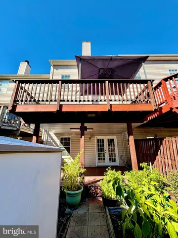 a view of a chairs and table in the balcony