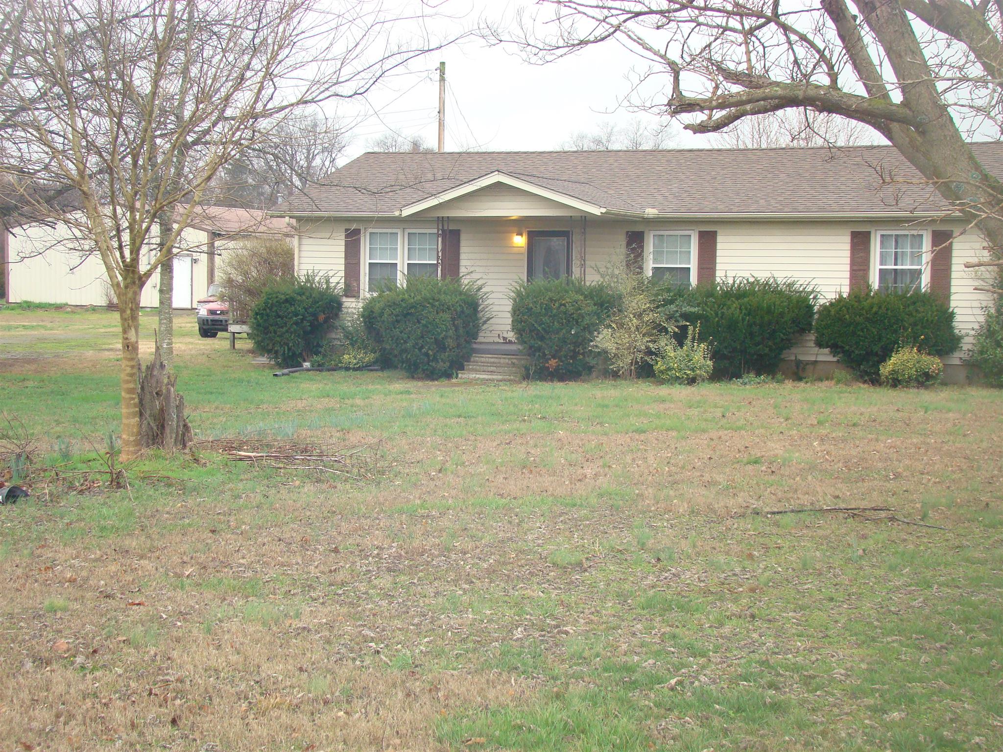 3579 Midland Road Bell Buckle, TN 37020 - Photo 1 of 30 a front view of a house with a yard