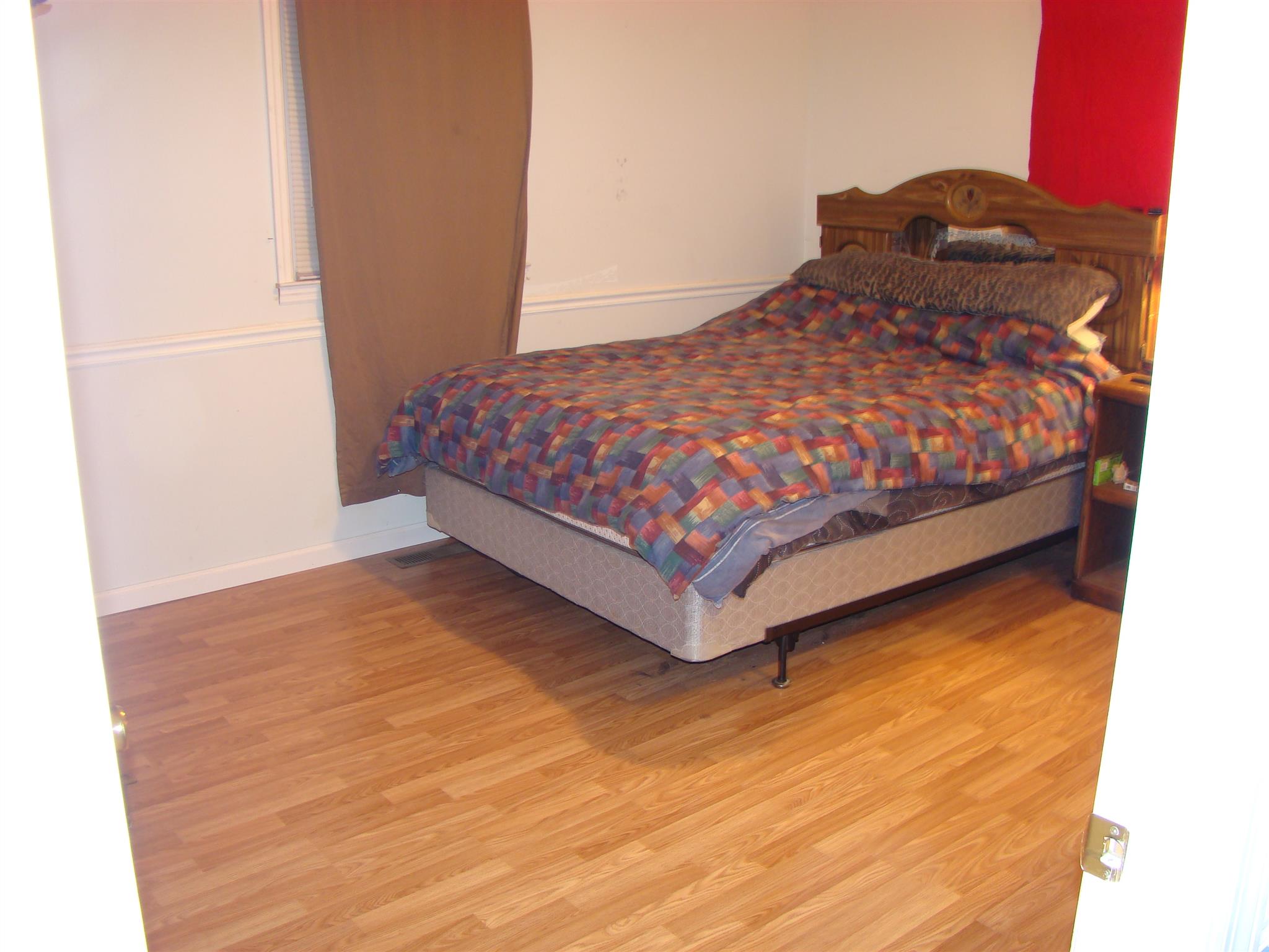 3579 Midland Road Bell Buckle, TN 37020 - Photo 12 of 30 a bedroom with a bed and a night stand