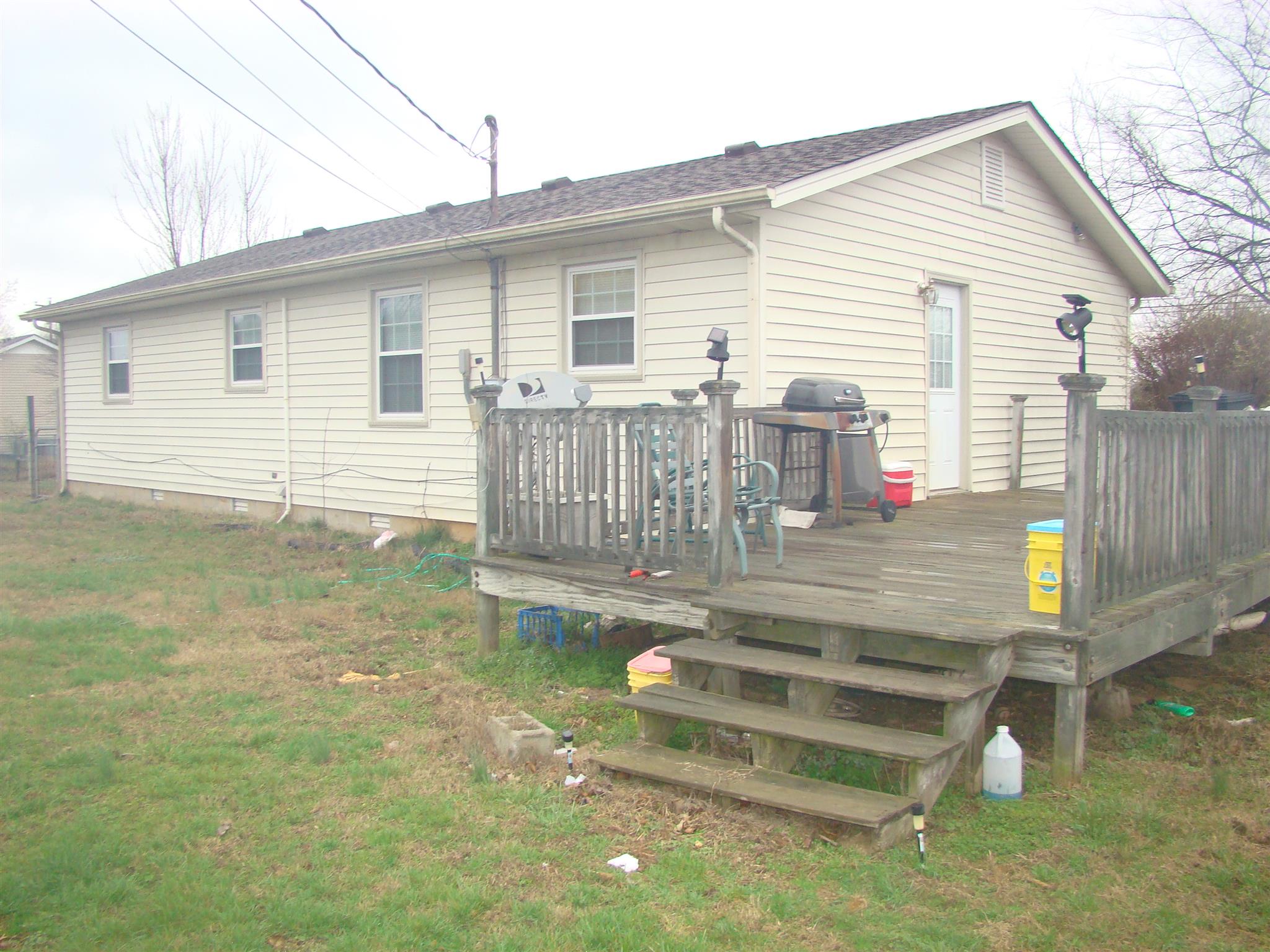 3579 Midland Road Bell Buckle, TN 37020 - Photo 15 of 30 a view of a house with a yard and wooden fence