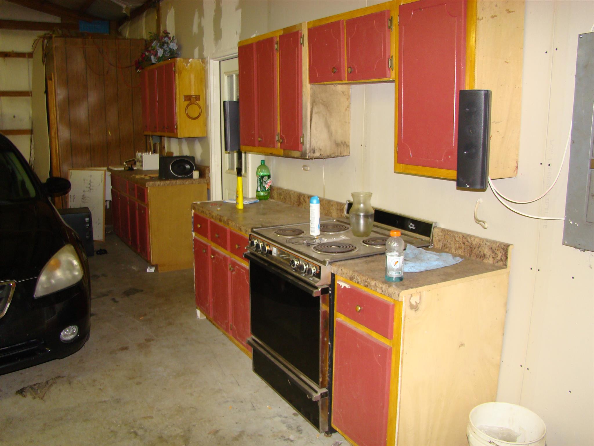 3579 Midland Road Bell Buckle, TN 37020 - Photo 24 of 30 a kitchen with a sink stove and cabinets