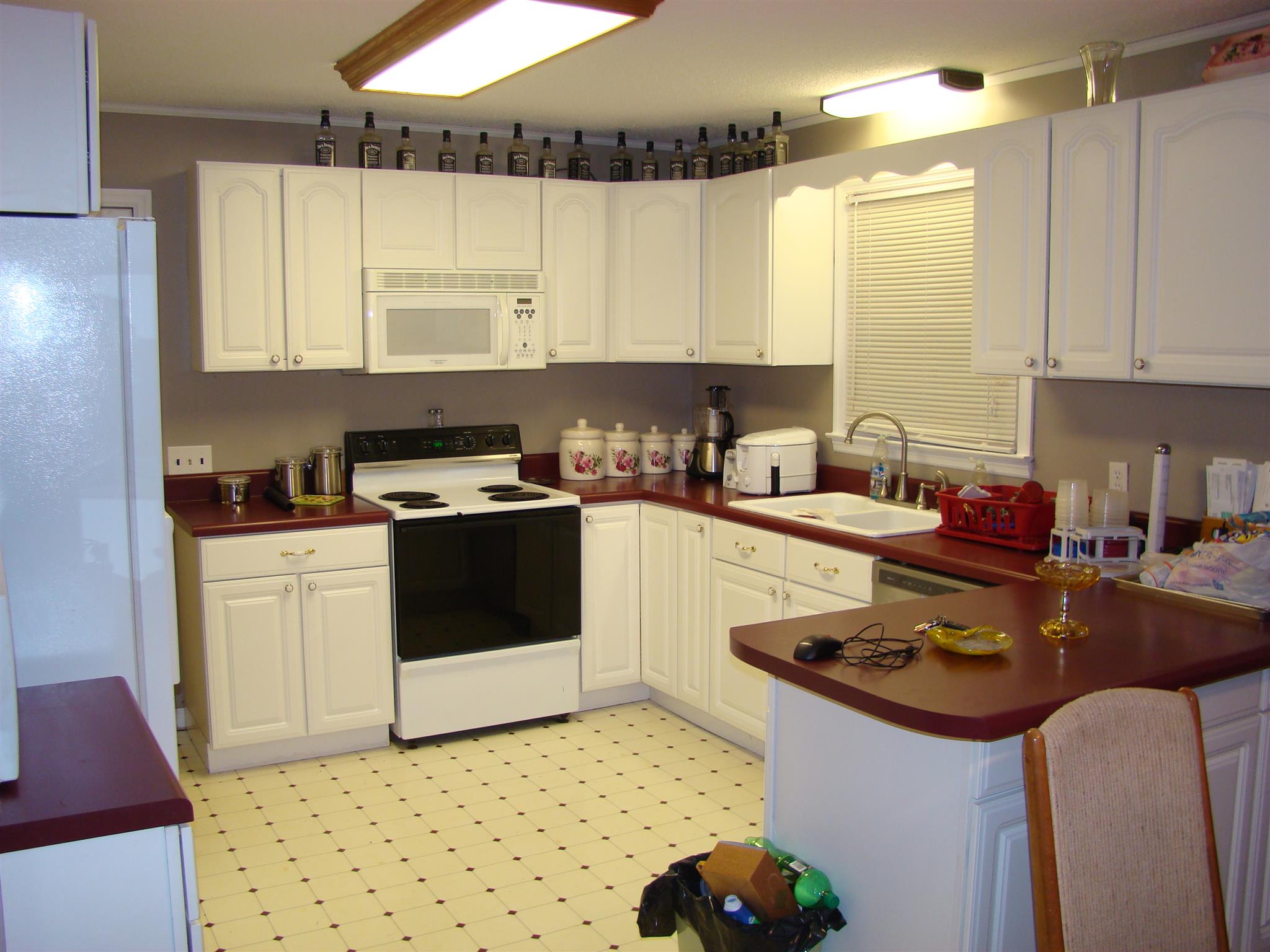 3579 Midland Road Bell Buckle, TN 37020 - Photo 3 of 30 a kitchen with a sink stove and cabinets