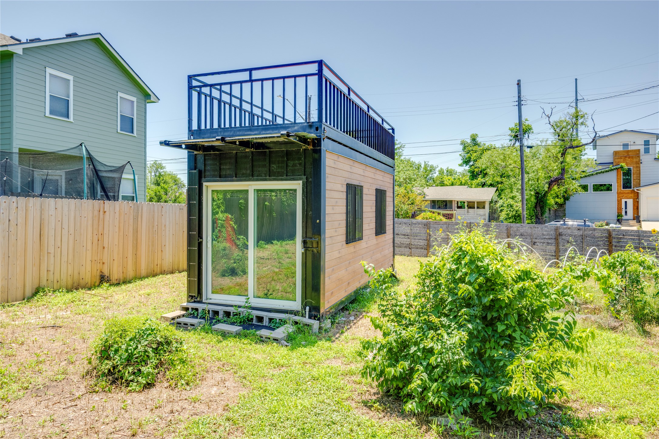 1707 Overhill Drive Austin, TX 78721 - Photo 29 of 36 A unique container home features a rooftop deck and a private backyard with garden space.