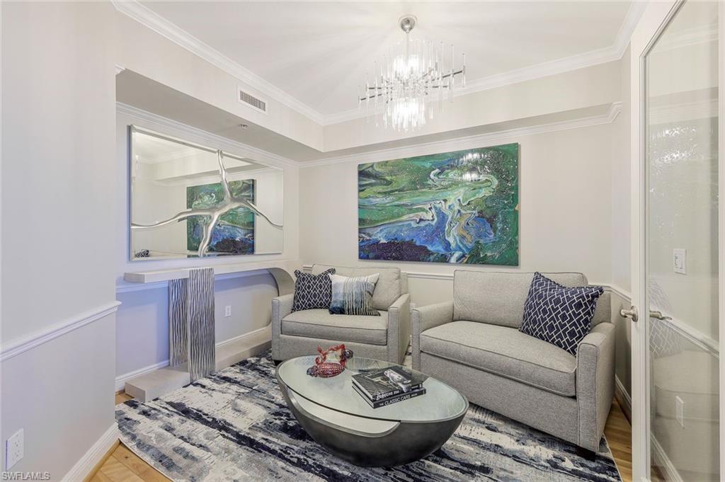 1060 Borghese Lane, Unit 2002 Naples, FL 34114 - Photo 13 of 22 a living room with furniture and a large window