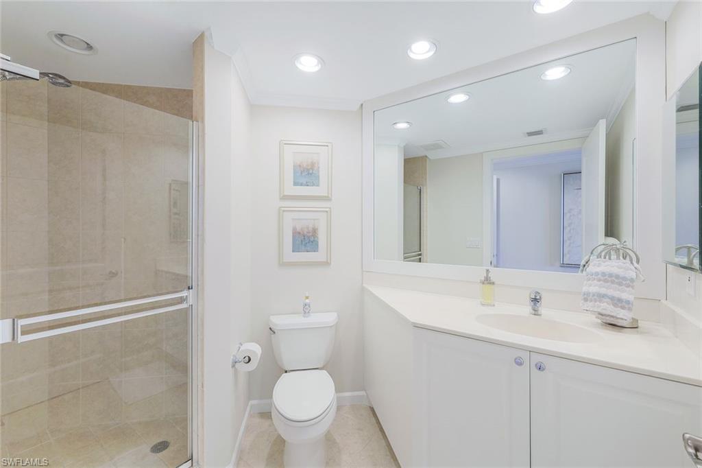 1060 Borghese Lane, Unit 2002 Naples, FL 34114 - Photo 14 of 22 a bathroom with a sink toilet and shower