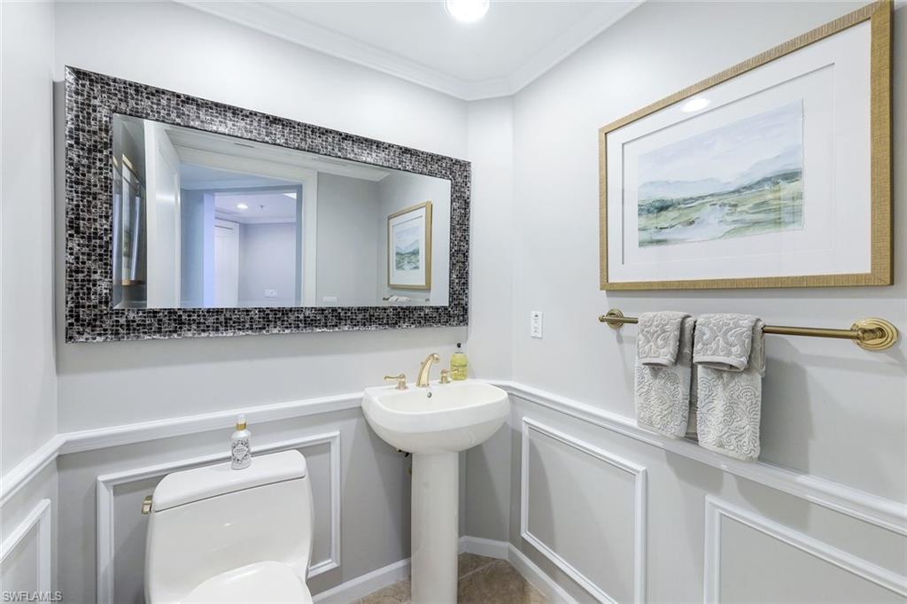 1060 Borghese Lane, Unit 2002 Naples, FL 34114 - Photo 16 of 22 a bathroom with a sink mirror and vanity