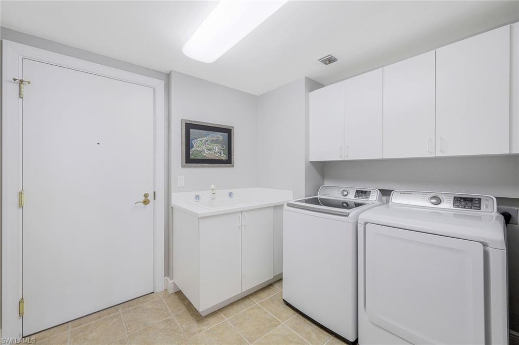 1060 Borghese Lane, Unit 2002 Naples, FL 34114 - Photo 17 of 22 a utility room with dryer and washer
