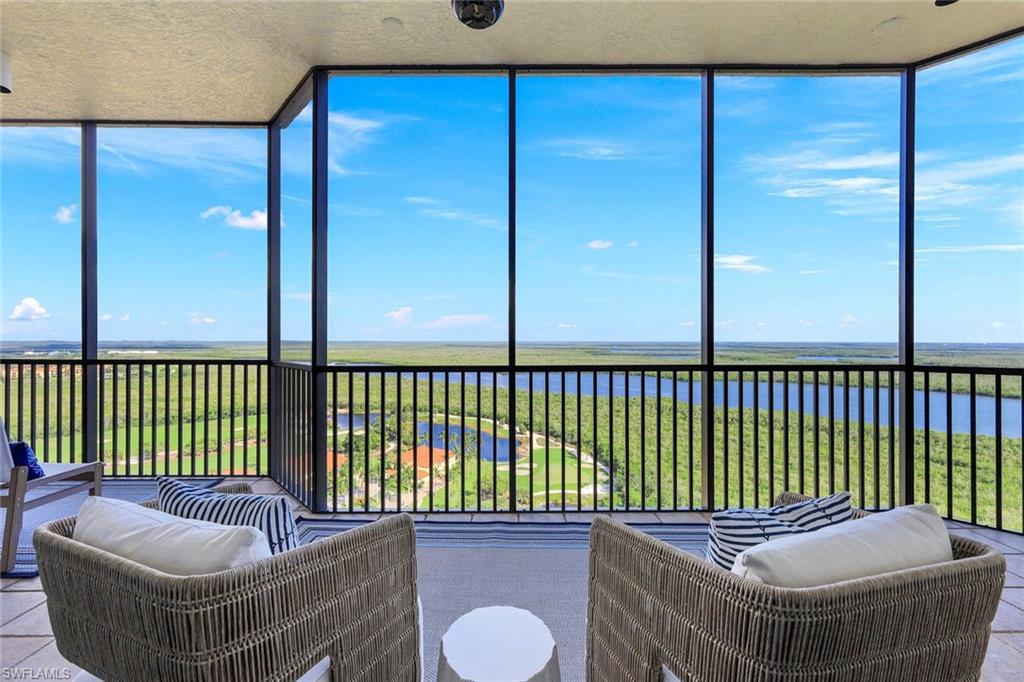 1060 Borghese Lane, Unit 2002 Naples, FL 34114 - Photo 2 of 22 a balcony with a couch