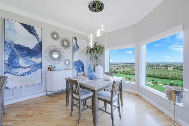 a balcony with furniture and a potted plant