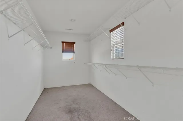 a view of a bathroom with closet area