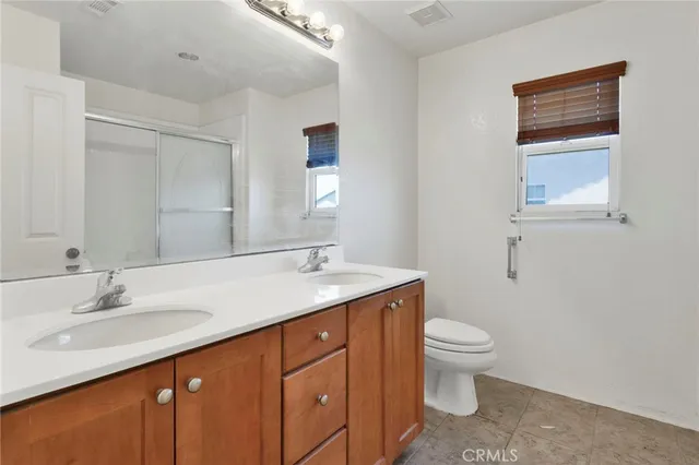 a bathroom with a shower and a mirror