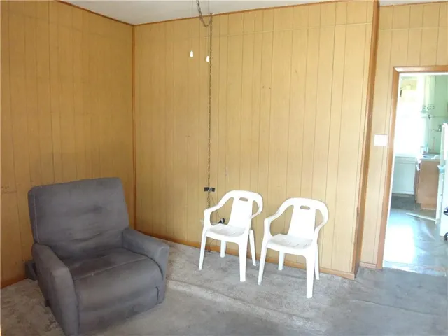 a view of a livingroom with furniture and windows