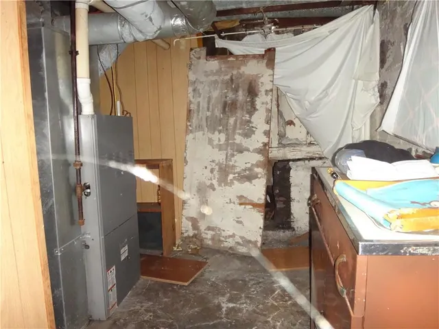 a bathroom with a granite countertop shower and a sink