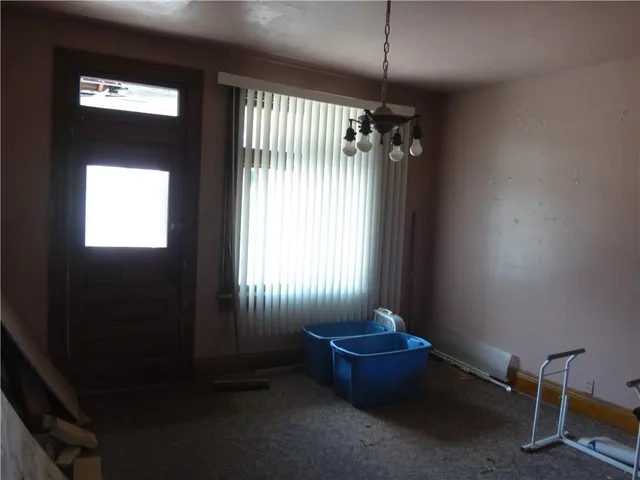 wooden floor and window in an empty room