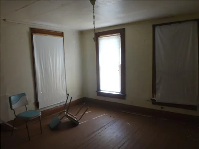 a bathroom with a granite countertop sink and a toilet