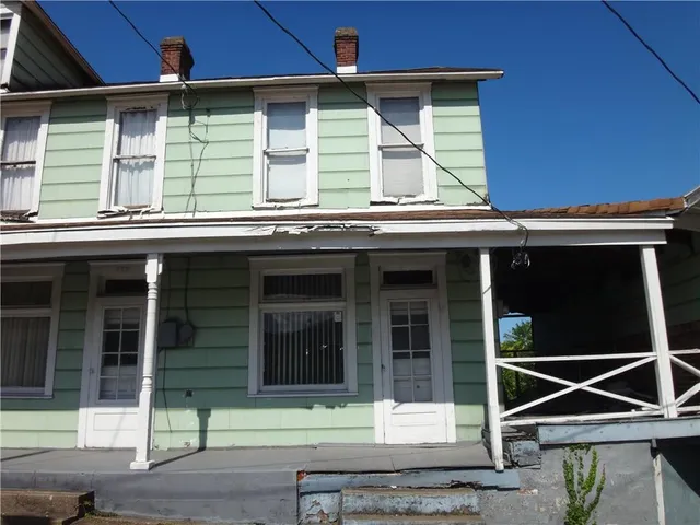 a front view of a house with a garage