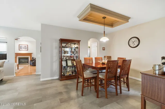 a view of a dining room and chandelier fan