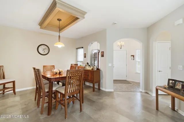 a view of a room with furniture and window
