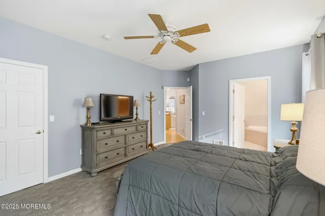 a bedroom with a bed and a television