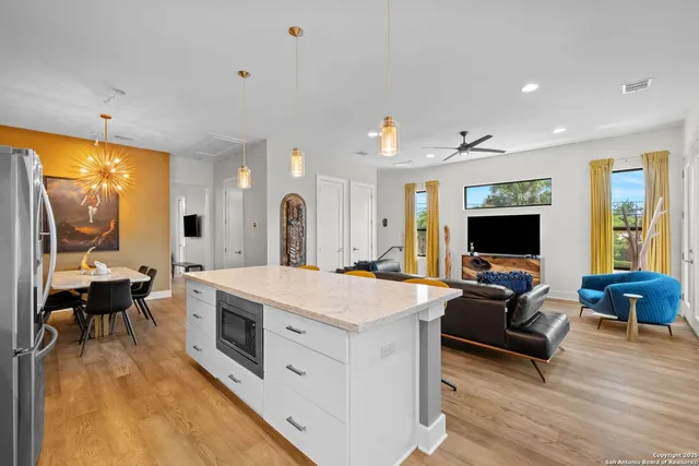 a living room with furniture flat screen tv and a fireplace