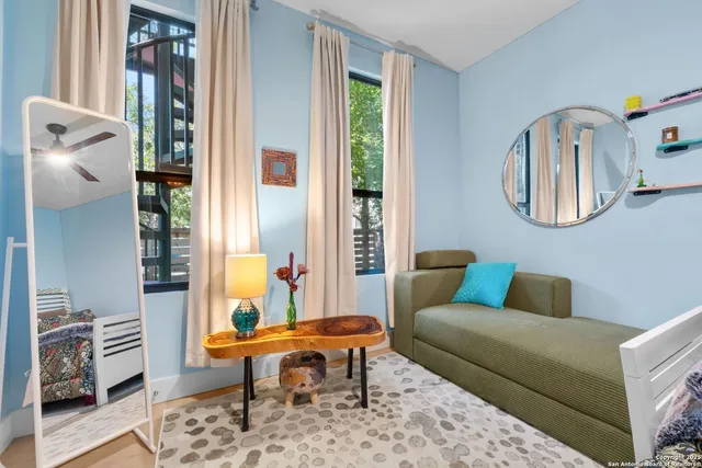 a living room with furniture and a window