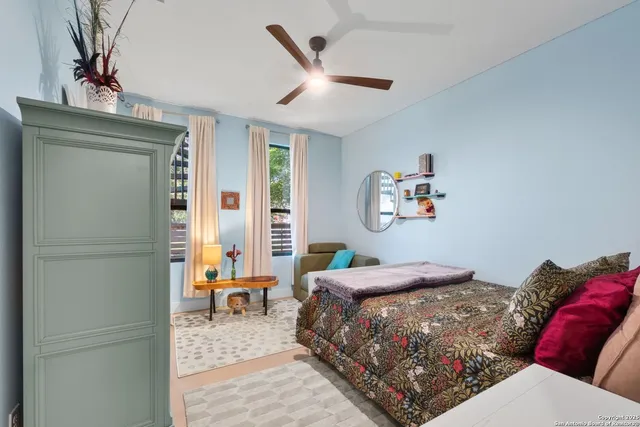 a bedroom with a bed and a couch