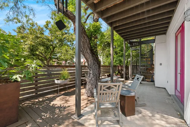 a view of a chairs and table in patio