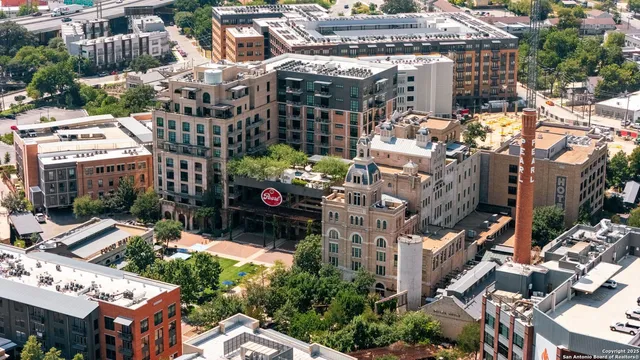 a picture of a wall with a white building