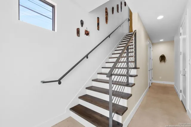 a view of entryway with wooden floor