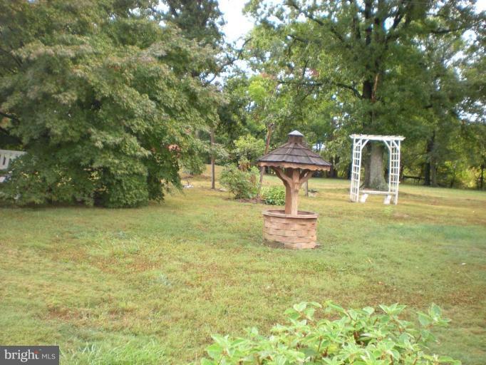 16014 Barnesville Road Boyds, MD 20841 - Photo 6 of 6 a front view of a house with a yard