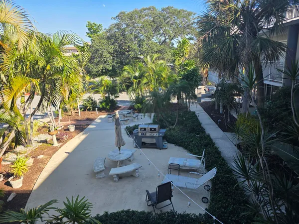 a view of a backyard with swimming pool