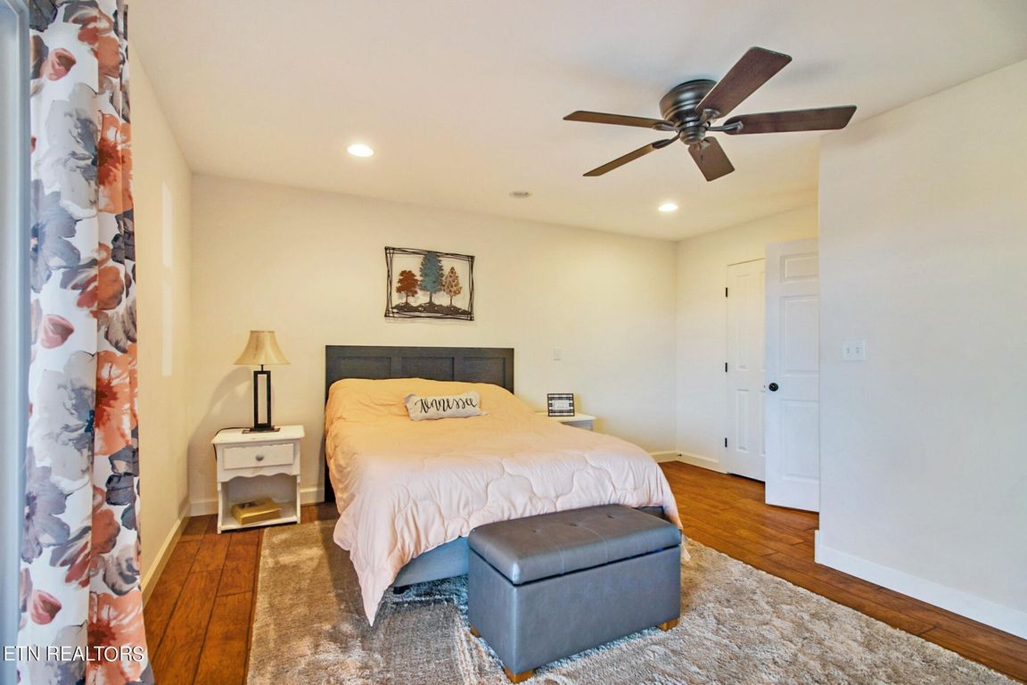 1375 Back Bone Road Sparta, TN 38583 - Photo 30 of 52 a bedroom with a bed and a chandelier