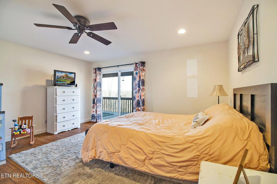 1375 Back Bone Road Sparta, TN 38583 - Photo 31 of 52 a large bed sitting in a bedroom next to a window
