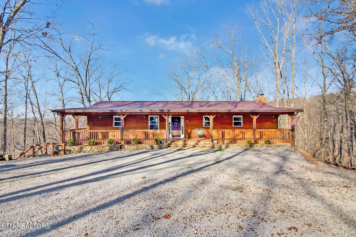1375 Back Bone Road Sparta, TN 38583 - Photo 43 of 52 a view of a large white house with a large tree
