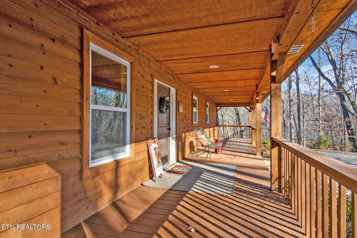 1375 Back Bone Road Sparta, TN 38583 - Photo 7 of 52 a view of a porch with wooden floor and iron stairs