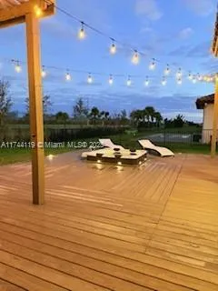 a lobby with furniture and a ceiling fan